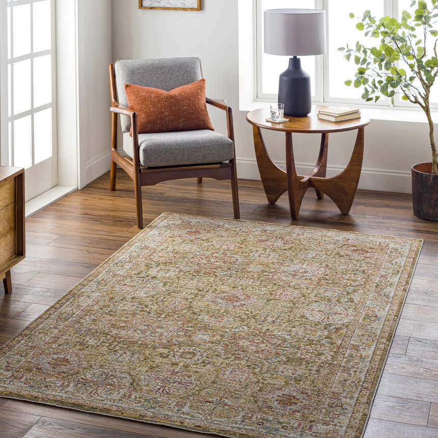 Living room scene with Ange Tan Rich Textured Traditional Rug, gray chair, and wooden side table. Roomscene-Rectangle