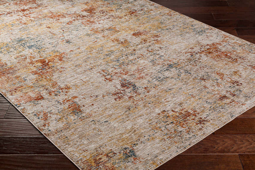 Close-up of the textured Chas Tan Rich Traditional Rug; bone, clay, and dark gray colors. Corner