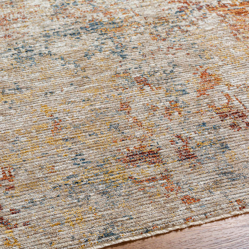 Close-up of the Chas Tan Rich Textured Traditional Rug, showing bone, clay, dark gray, and walnut colors. Texture