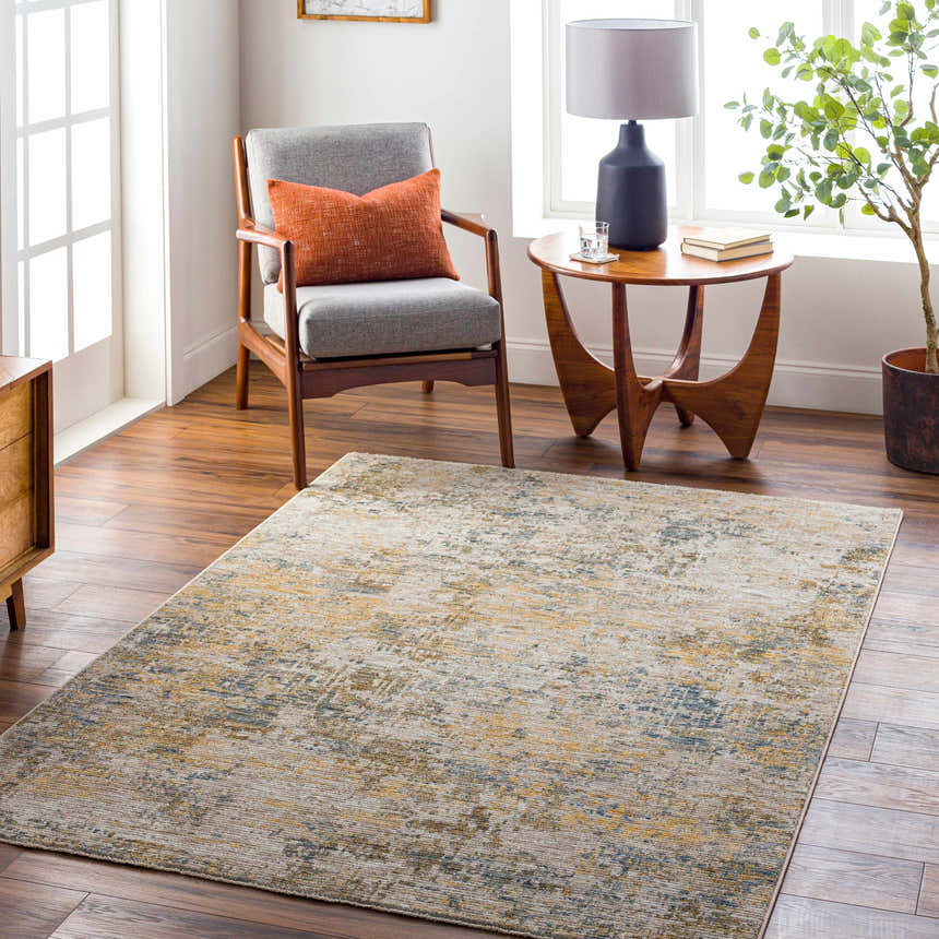 Living room scene with a Chas Beige Rich Textured Traditional Rug, gray chair, and wood accents. Roomscene-Rectangle