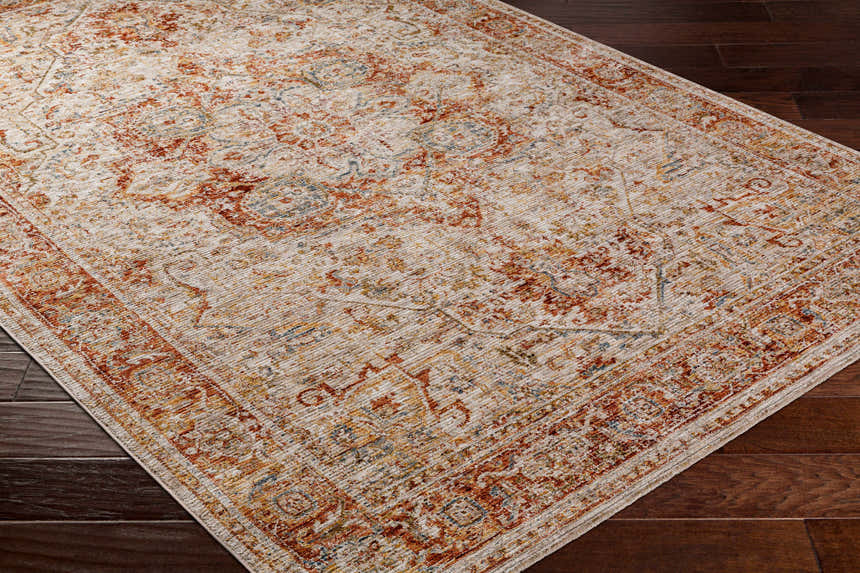 Close-up of the Cress Rust Rich Textured Traditional Rug showing its clay, brown, and peach tones. Fold