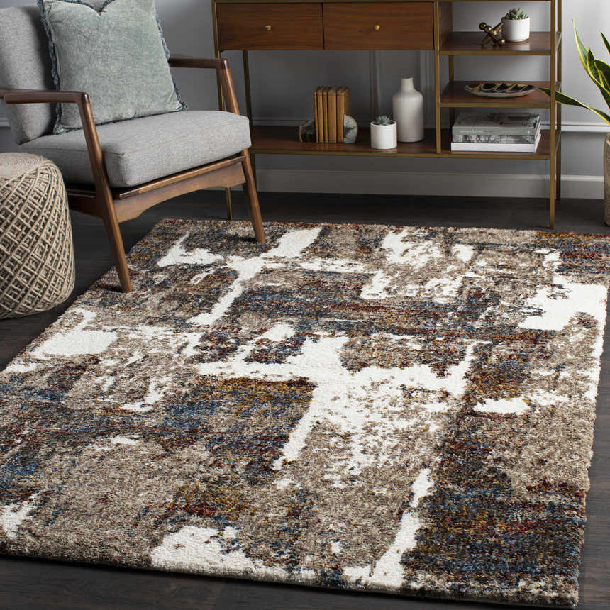 Living room scene with a Silvis Boutique Area Rug in burgundy, cream, blue, and gray. Modern decor with wood accents. Roomscene-Rectangle
