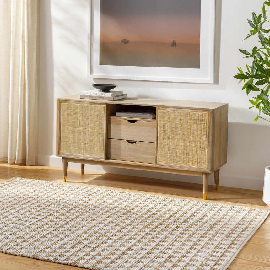 Living room scene with a Colm Recycled White Jean Rug, light wood cabinet, neutral walls, and natural light. Roomscene-Rectangle