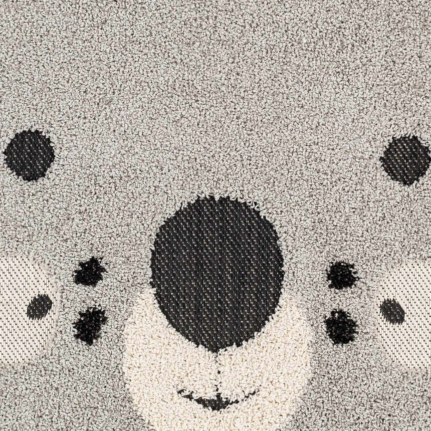 Close-up of the Kids Koala Animal Print Nursery Area Rug, featuring a gray, black, and natural koala face design. Swatch