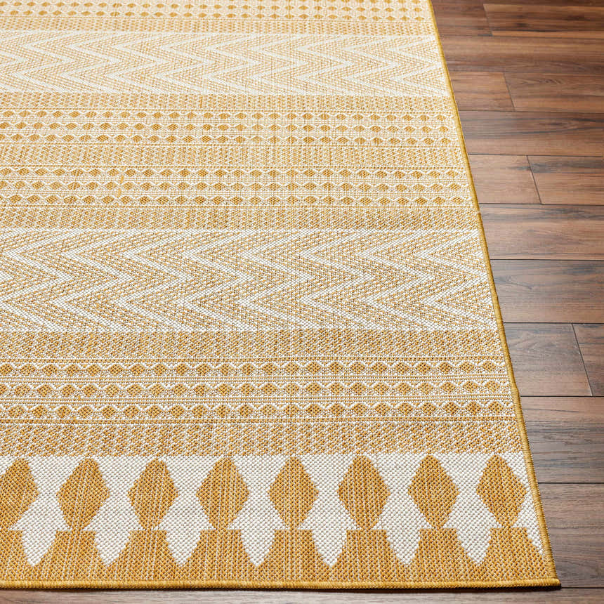 Close up of the Asif Mustard Area Rug showing its beige, bone, and mustard geometric pattern and texture. Front