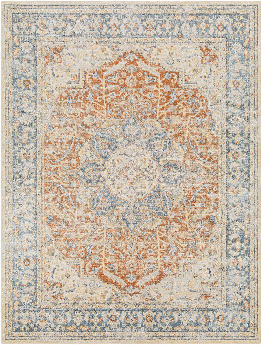 Close-up of Emke Rust Washable Area Rug. Features traditional design in rust, beige, gray, and blue tones. Machine woven texture. Design-Rectangle-537