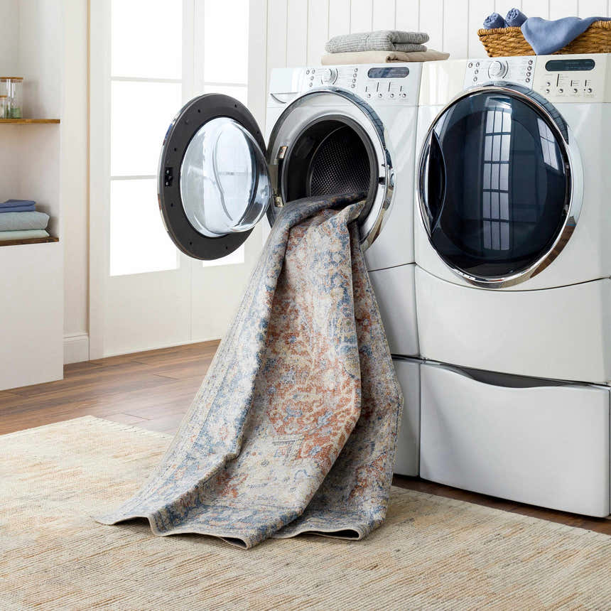 Emke Rust Washable Area Rug in a laundry room being washed in a front load washing machine. Easy care rug. Washing-Machine