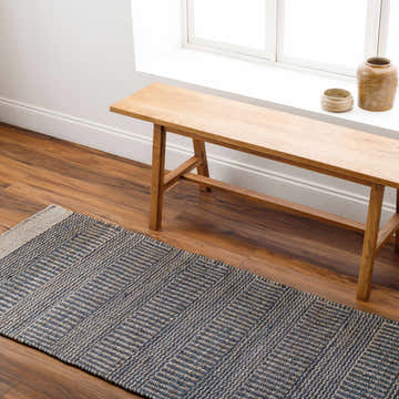 Entryway with wood bench and Navy Elle Jute Rug runner on wood floor. Scandinavian style. Roomscene-Runner