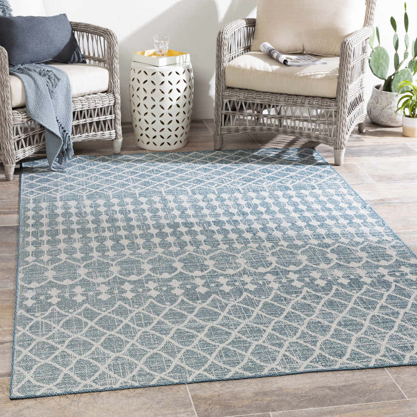 Outdoor patio scene with wicker chairs and Blue Ivory Summit Indoor & Outdoor Area Rug. Roomscene-Rectangle
