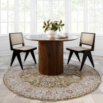 Bright dining room with round wood table and Crescentia Green Textured Rug, farmhouse style. Roomscene-Round