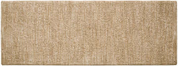 Close-up of the Kyran Tan Area Rug showing its khaki and tan colors and traditional, subtle floral pattern. Design-Runner-2773