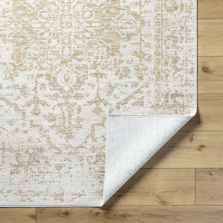 Close-up of Sunee Luxe Rug in ash, pearl, and silver gray. Farmhouse style, traditional pattern, machine woven texture. Fold