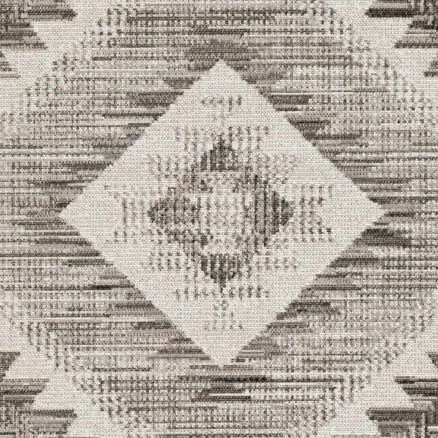 Close-up of Spade Area Rug showing a geometric diamond pattern in black, light gray, light slate, and white. Swatch