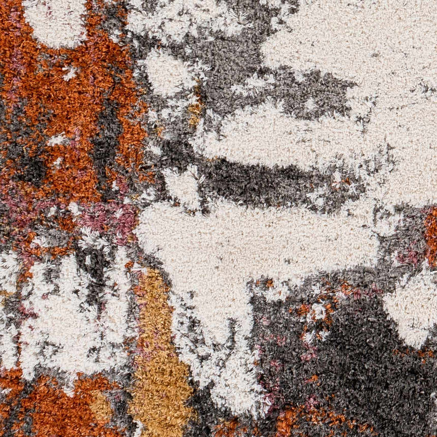 Close-up of the Shep Area Rug showing its shag texture and abstract pattern in dark beige, brown, lambswool, and smoke. Swatch