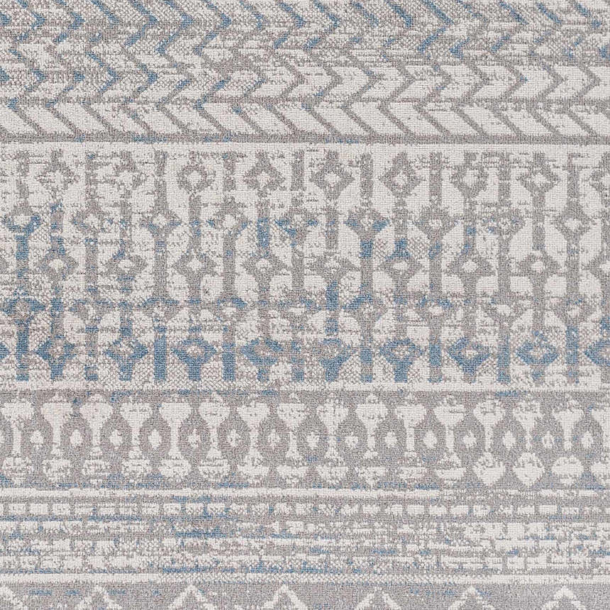 Close-up of Tambac Blue & Gray Washable Area Rug design. Contemporary rug with geometric patterns and distressed texture. Swatch