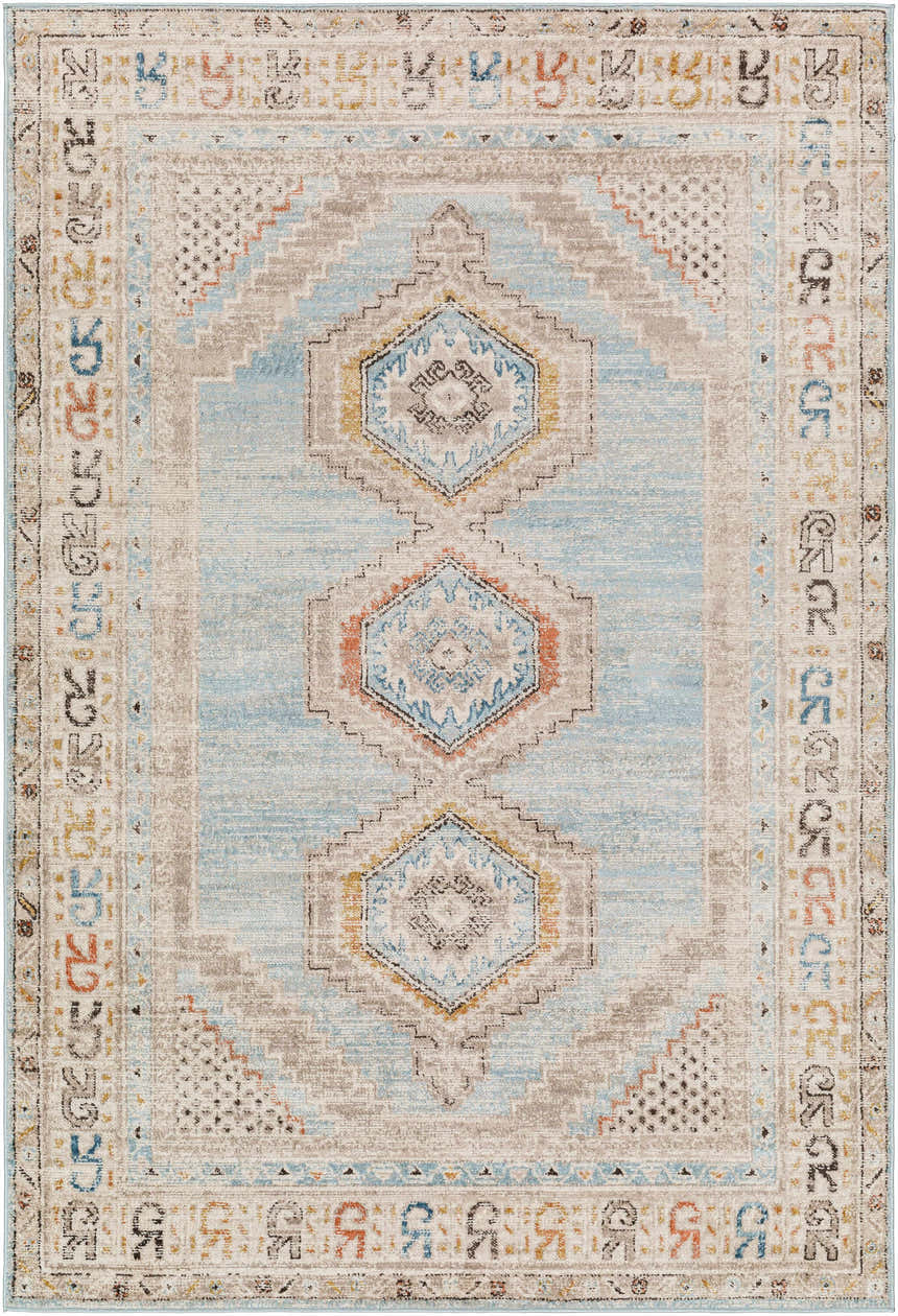 Close-up of the Iresh Area Rug, a traditional rug in cloud gray, beige, brown, and blue with a geometric pattern. Design-Rectangle-537
