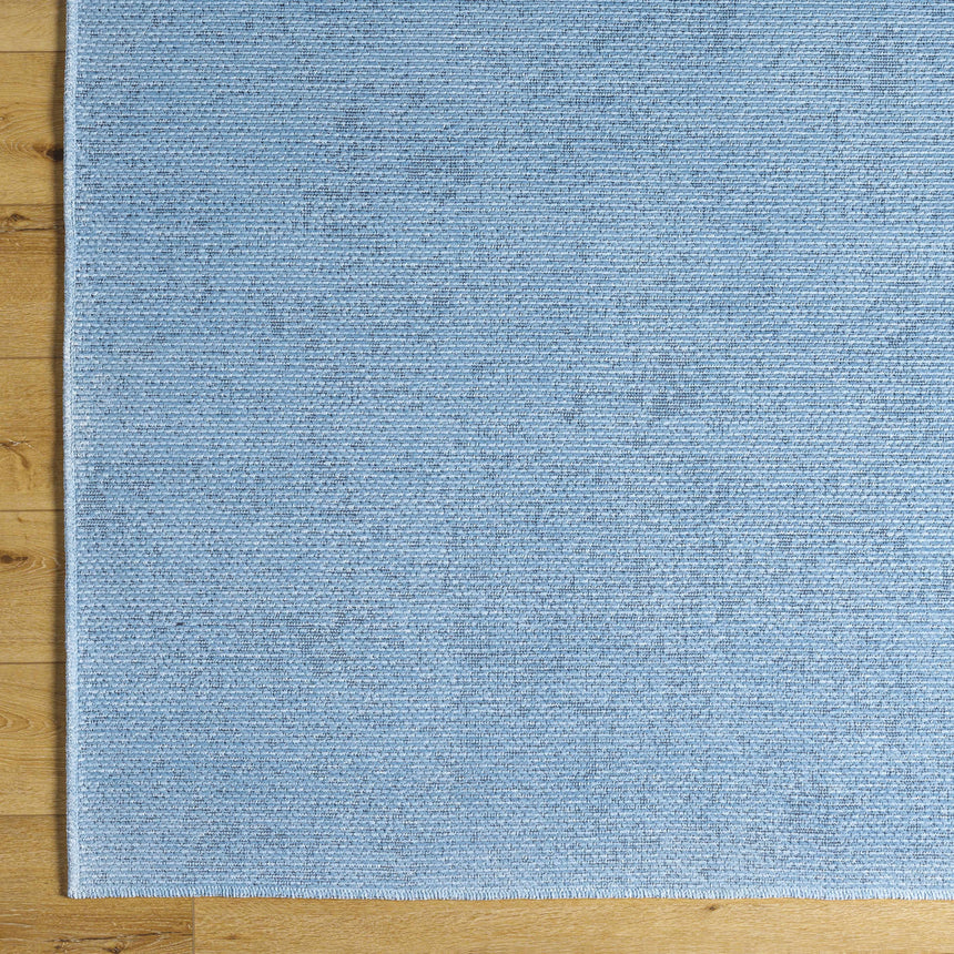 Isako Blue Solid Washable Area Rug - Clearance