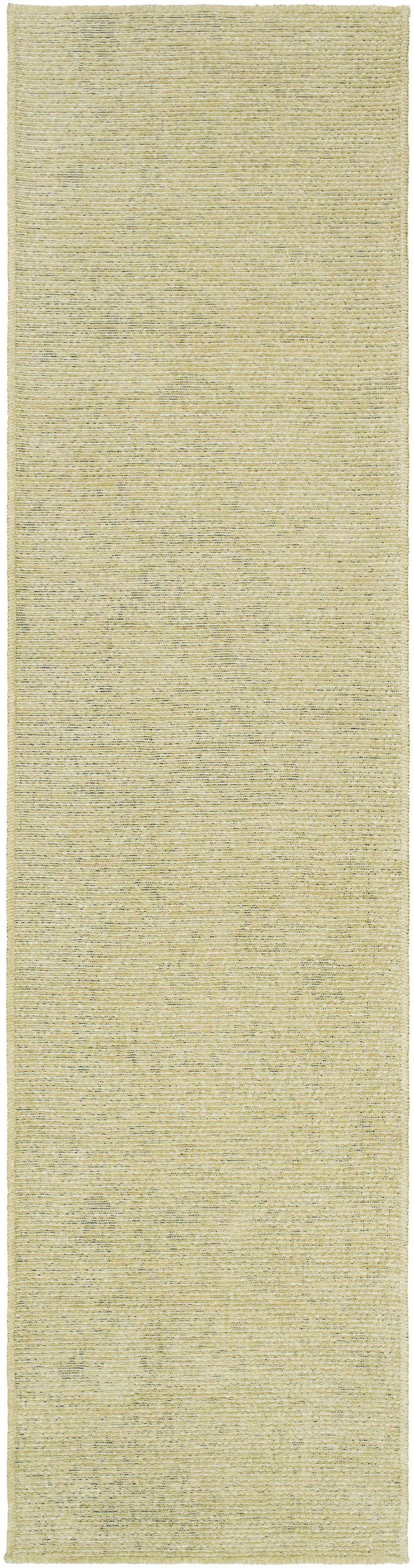 Close-up of the Isako Solid Lime Washable Area Rug. The rug has a subtle texture and a soft, light green color. Design-Runner-2710