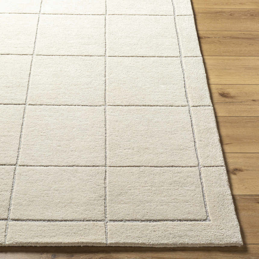 Close-up of the Siarl Cream Checkered Area Rug showing the beige wool texture and contemporary checkered design. Front