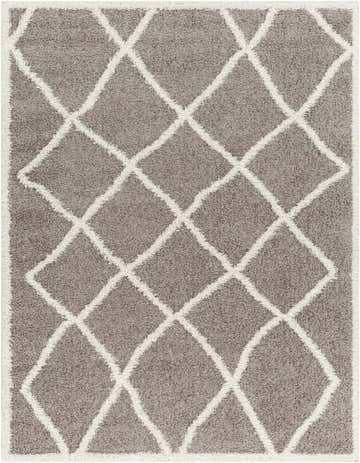 Close-up of the Alkas Area Rug, a gray shag rug with a white geometric diamond pattern. Contemporary style. Design-Rectangle-537