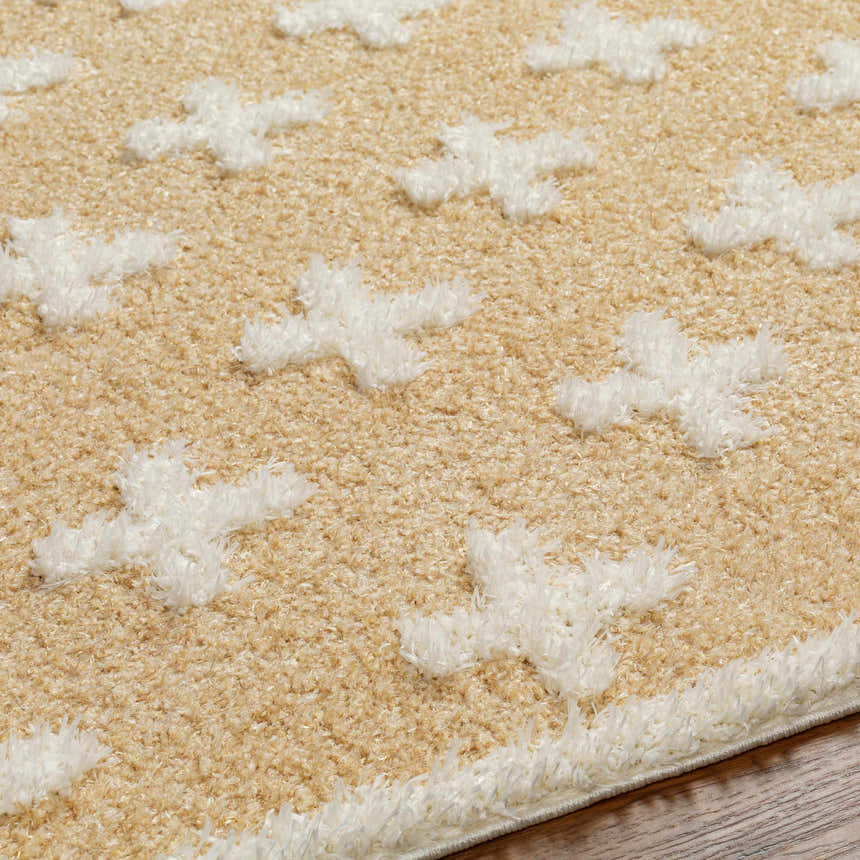 Close-up of the Satu Beige Area Rug, a shag rug with a geometric Moroccan design and soft, plush texture. Texture