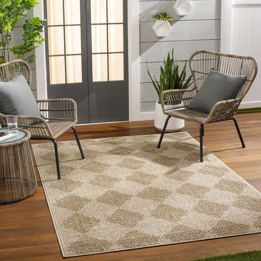 Patio scene with wicker chairs and Broox Beige Area Rug on wood floor. Roomscene-Rectangle