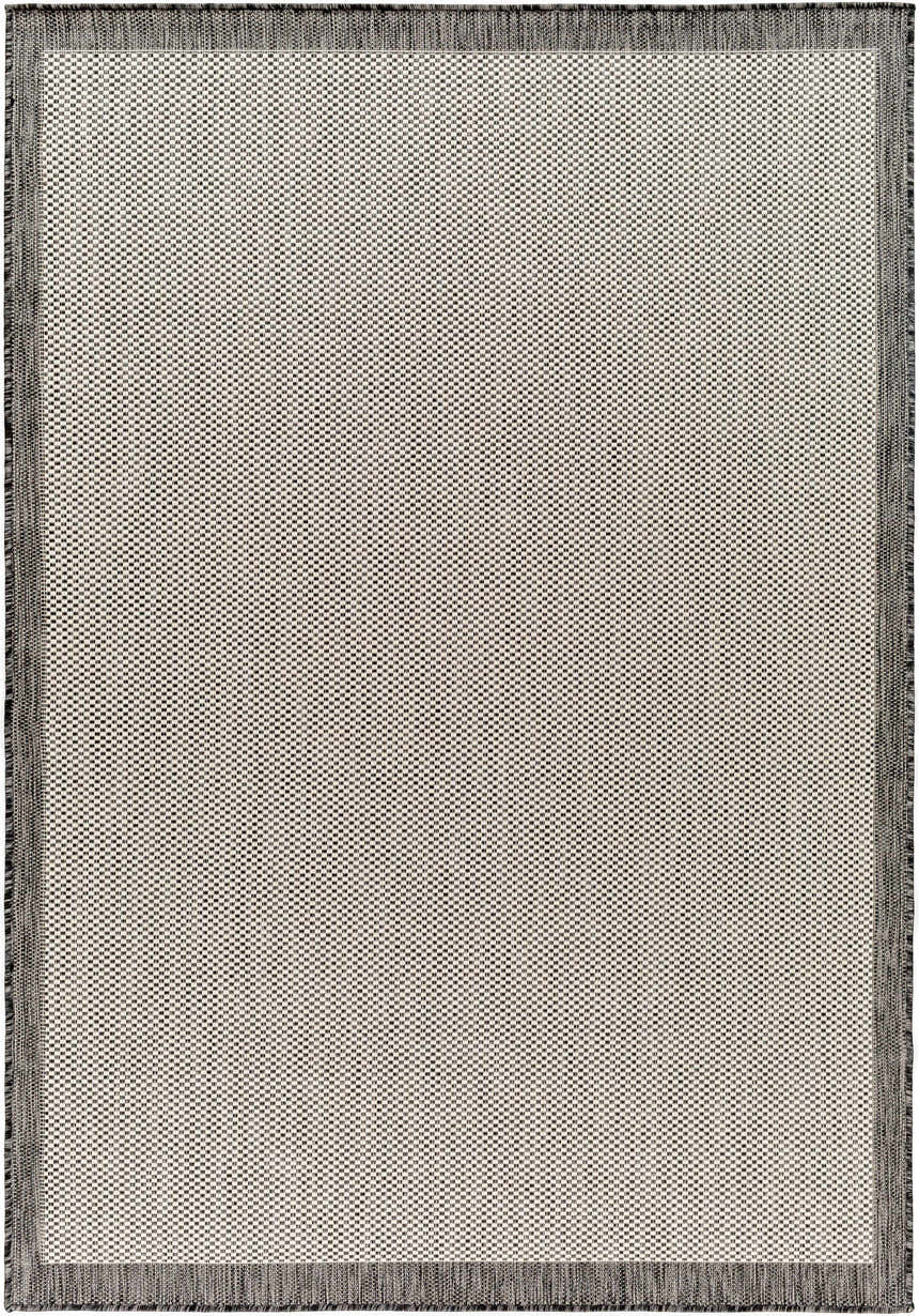 Close-up of the Aleid Gray Area Rug, a machine-woven rug with a small beige and gray geometric pattern and fringed edges. Design-Rectangle-537