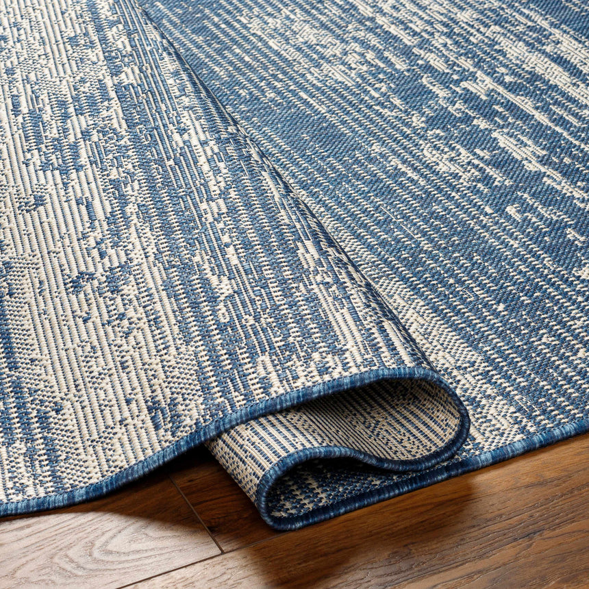 Cline Blue Area Rug - Promo