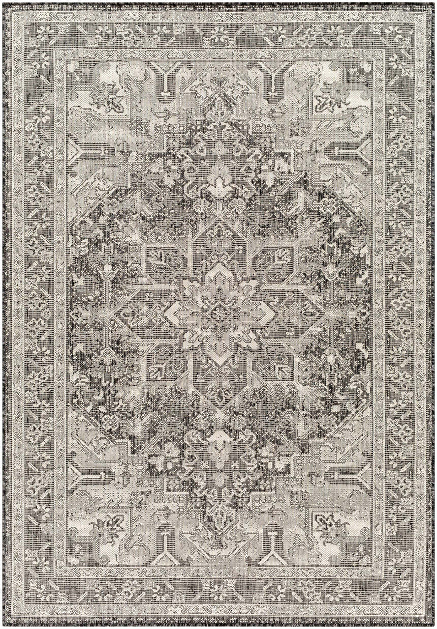 Detailed view of the Cohen Nutmeg Area Rug, showcasing its traditional beige, bone, and charcoal pattern and machine-woven texture. Design-Rectangle-537