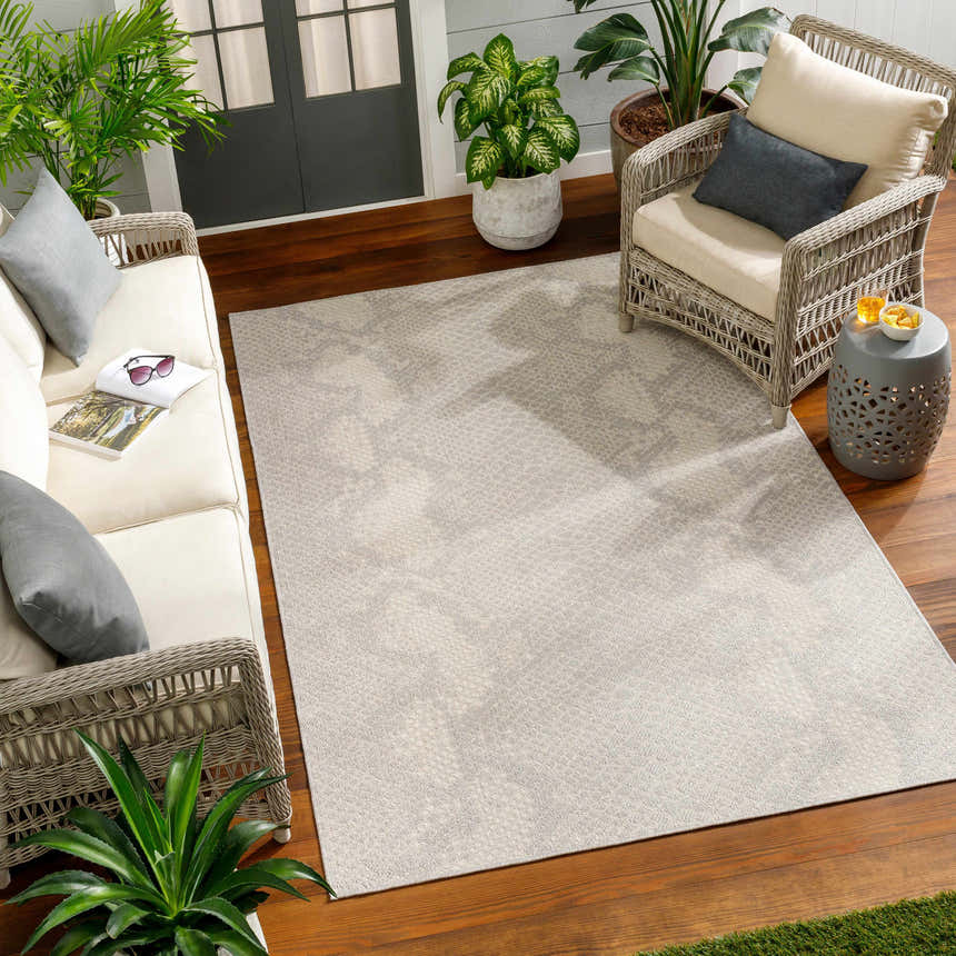 Sunroom with wicker furniture and Estee Cream Snake-Patterned Area Rug. Beige and gray tones create a relaxing vibe. Roomscene-Rectangle
