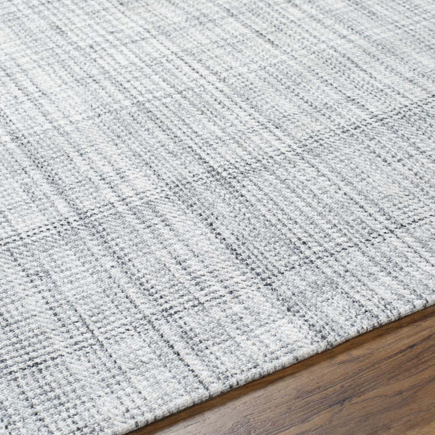 Close-up of the hand woven Jezel Gray Area Rug showing its subtle farmhouse style pattern and soft texture. Texture