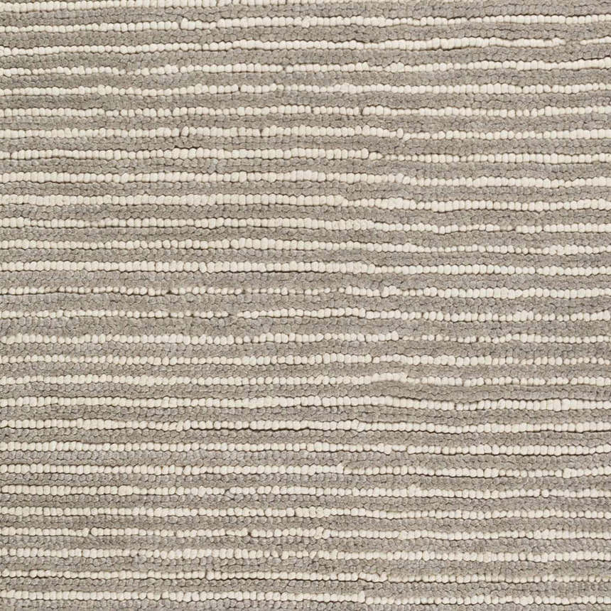 Close-up of the Sula Area Rug showing cream and gray horizontal stripes and hand woven wool texture. Swatch