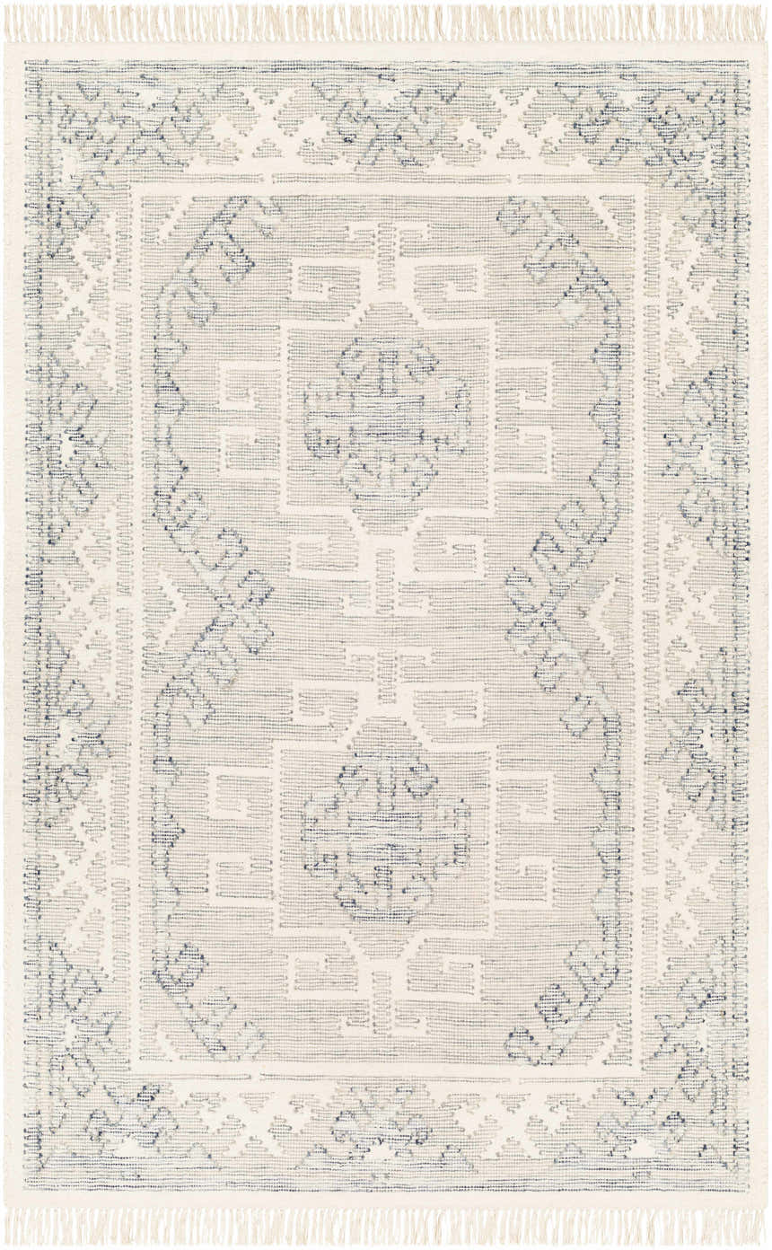 Close-up of the hand woven Anund Area Rug. Beige wool rug with a dark gray geometric pattern and fringe. Design-Rectangle-576