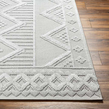 Close-up of the Gabin Area Rug in arctic stone. Contemporary geometric design with a soft, textured pile. Front