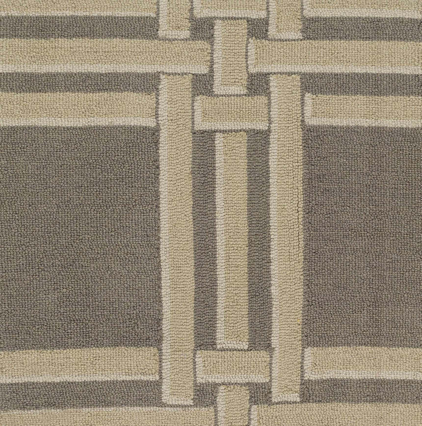Close-up of the hand-hooked Templeton Area Rug. Gray, ivory, and white wool form a contemporary geometric pattern. Swatch