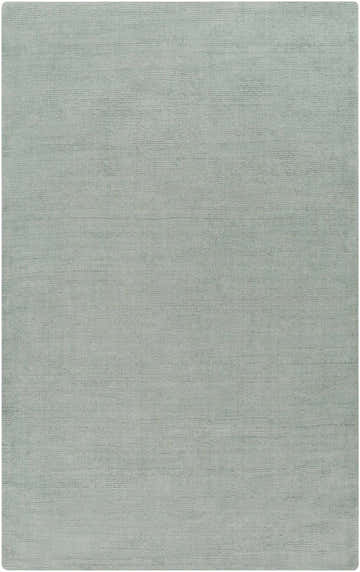 Close-up of the hand-loomed Brockton Solid Dusty Sage Wool Rug, showing its subtle texture and soft, muted sage color. Design-Rectangle-58