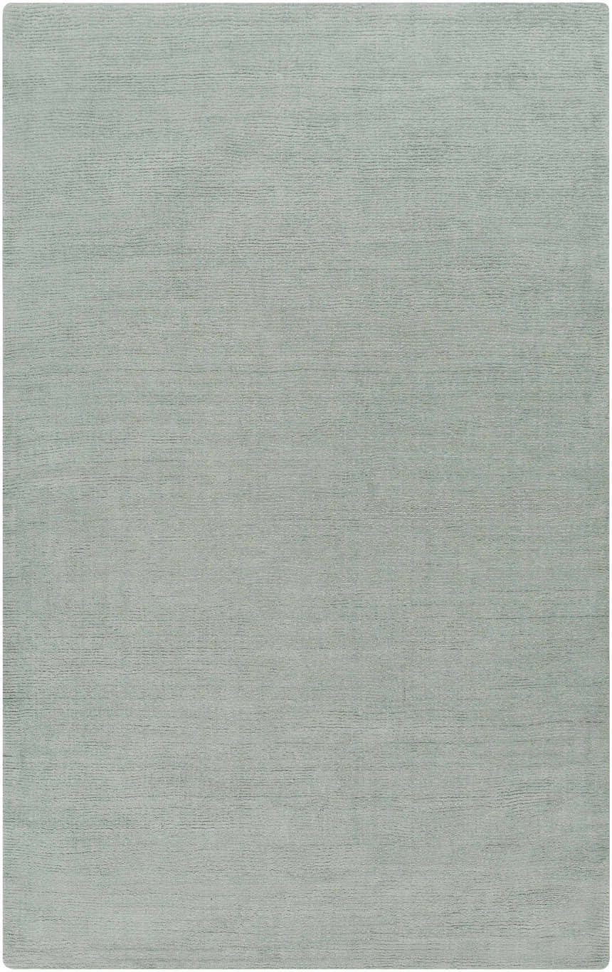 Close-up of the hand-loomed Brockton Solid Dusty Sage Wool Rug, showing its subtle texture and soft, muted sage color. Design-Rectangle-58
