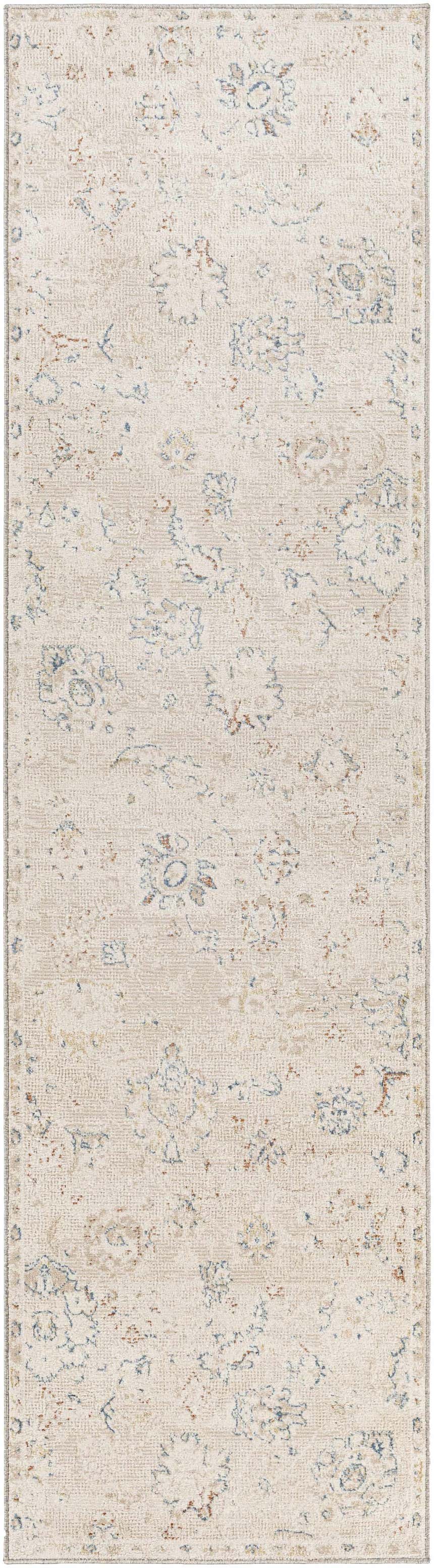 Close-up of the Tinampo Area Rug. Cream rug with a faded bohemian pattern in brick red, denim, and light gray. Design-Runner-2610