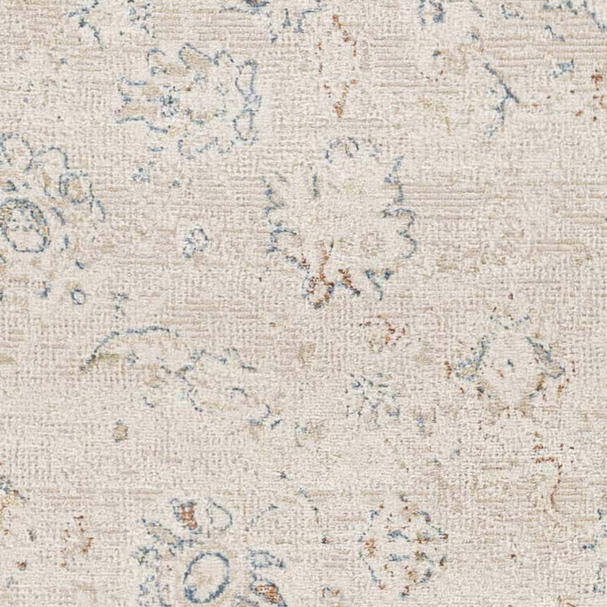 Close-up of the Tinampo Area Rug. Oatmeal background with brick red and denim floral pattern. Machine woven texture. Swatch