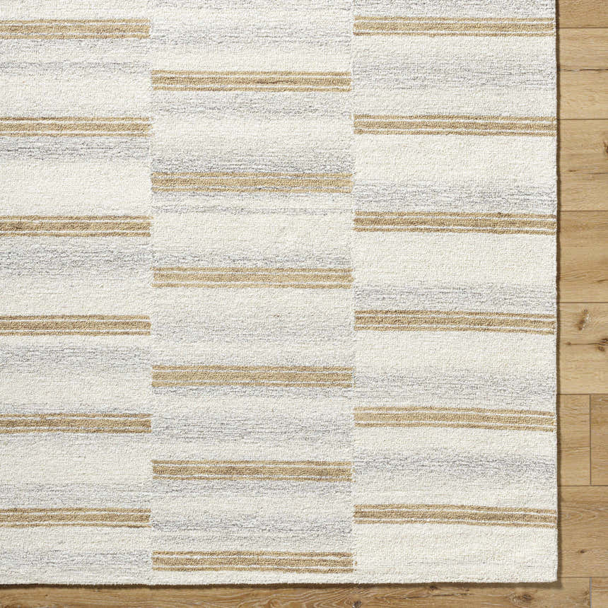 Close-up of Toren Broken-Striped Area Rug. Hand-tufted wool rug with ash, pearl, and prairie dust stripes. Farmhouse style. Corner