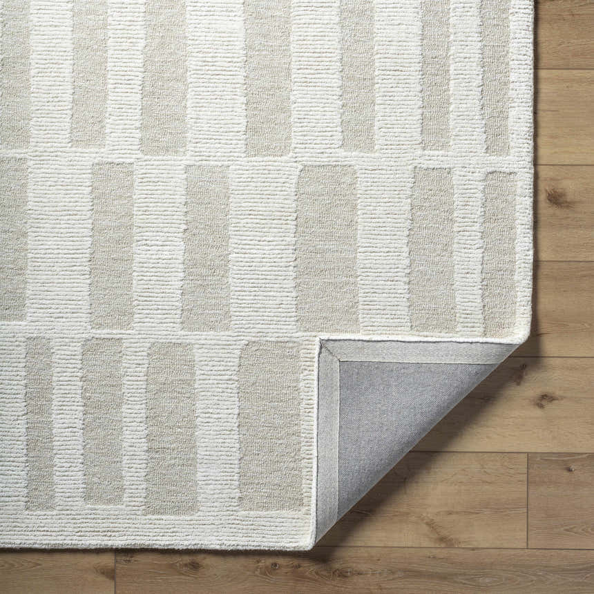Close up of Teige Light Silver Area Rug showing its wool texture and modern striped pattern. Fold