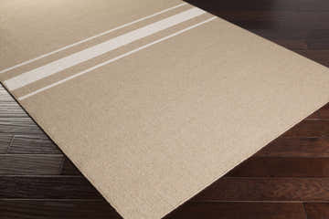 Close-up of the Twitty Area Rug. Tan wool rug with ivory stripes on dark wood floors. Farmhouse style. Corner