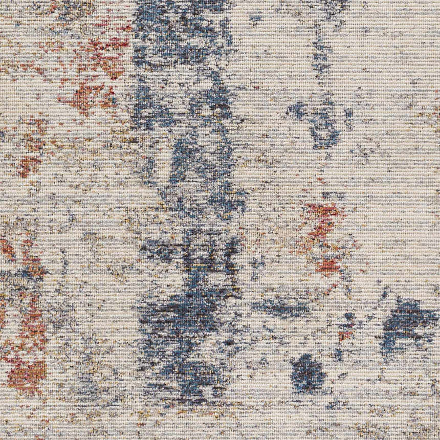 Close-up of Upminster Area Rug. Machine woven polyester rug with brick red, charcoal, and teal abstract pattern. Swatch