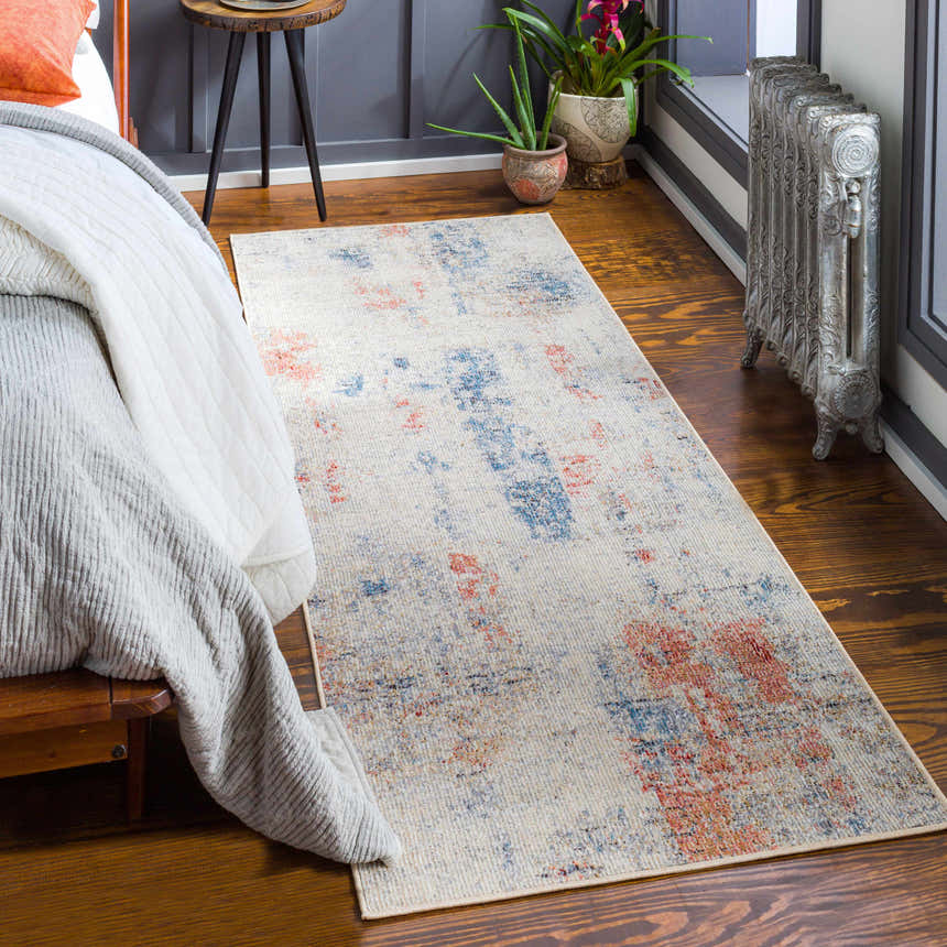 Bedroom scene with Upminster Area Rug in brick red, charcoal, and beige. Coastal style rug on wood floor. Roomscene-Runner