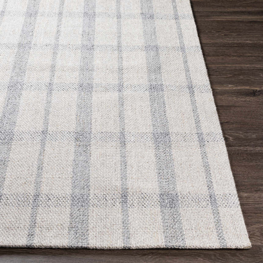 Close-up of the hand-woven Verdon Light Gray Plaid Rug showing its gray and oatmeal tones and textured wool blend. Front