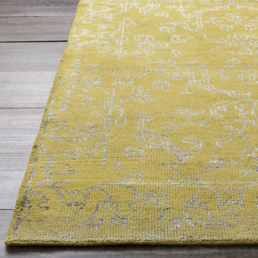 Close-up of the olive Voorhees Area Carpet showing its hand-knotted texture and slate-colored traditional design. Front