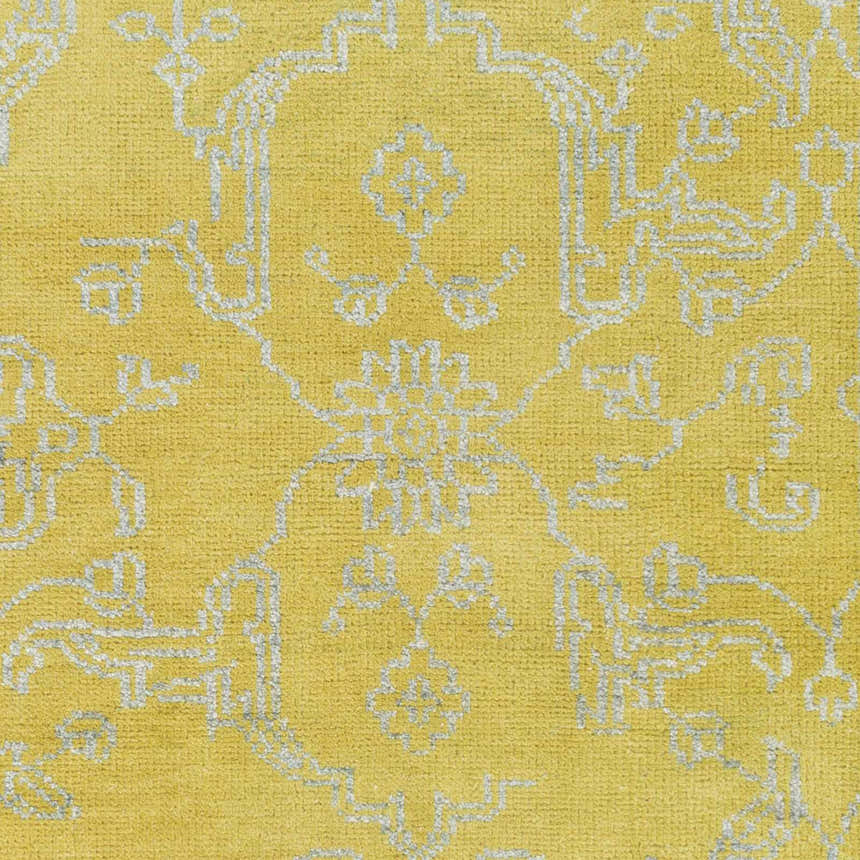 Close-up of the Voorhees Area Carpet in olive and slate. Hand-knotted wool and viscose rug with a traditional pattern. Swatch