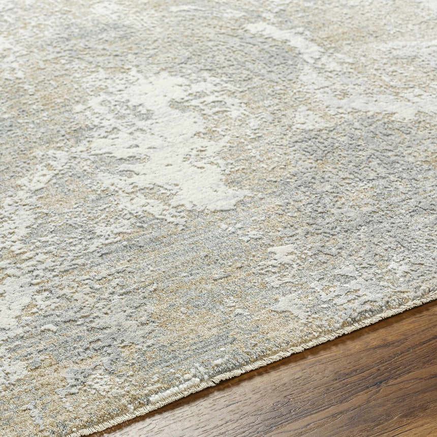 Close-up of the Owena Thick Luxe Boutique Rug. Abstract pattern in cream, light gray, light brown, and charcoal. Soft texture. Texture