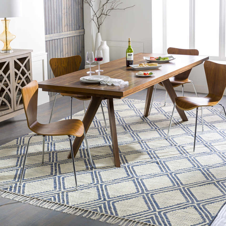 Dining room with a wood table and the blue and cream Walgett Carpet Area Rug. Roomscene-Rectangle