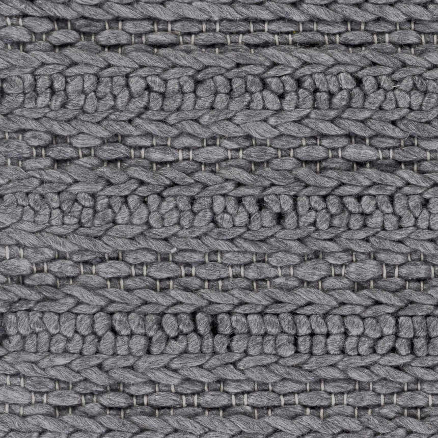 Close-up of the hand woven Warrendale Area Rug. Charcoal gray rug with a chunky, textured weave and natural fiber look. Swatch